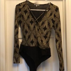 Long sleeve sparkly bodysuit. Deep v-neck. Size M